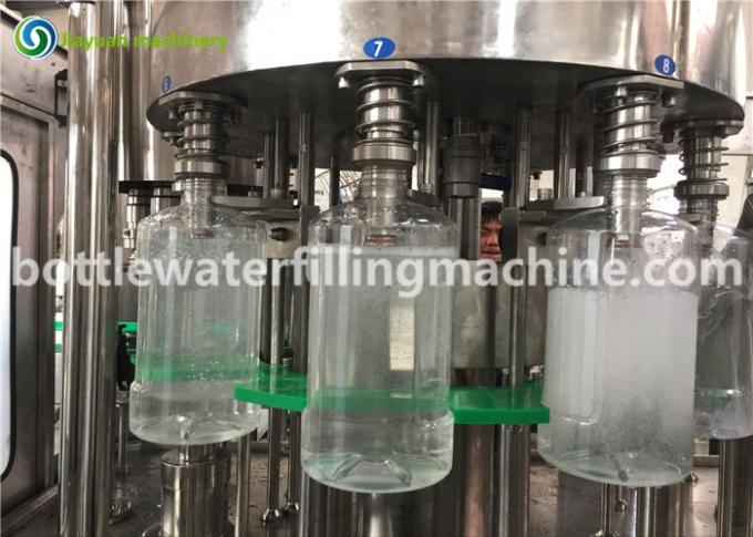 Machine de remplissage de bouteilles électrique industrielle de l'eau pour bouteille en plastique/en verre 1